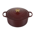 An Rhone/ burgundy colored 7 - 1/4 Quart Le Creuset Signature Enameled Cast Iron Round French/Dutch Oven