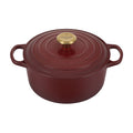 A Rhone/ burgundy colored 5 - 1/2 Quart Le Creuset Signature Enameled Cast Iron Round French/Dutch Oven