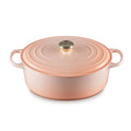 A Peche/ peach orange colored 8 Quart Le Creuset Signature Enameled Cast Iron Oval French/Dutch Oven 