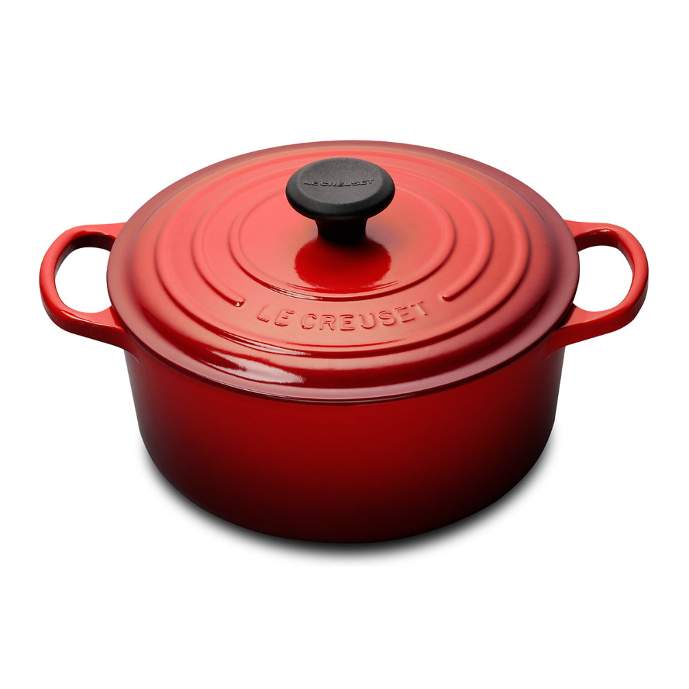 A cerise/ red colored 5 - 1/2 Quart Le Creuset Signature Enameled Cast Iron Round French/Dutch Oven