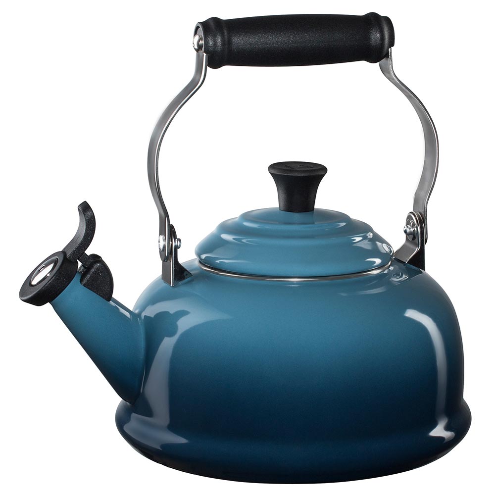 A marine/ blue colored Le Creuset Enameled Steel 1.7 Quart Classic Whistling Tea Kettle