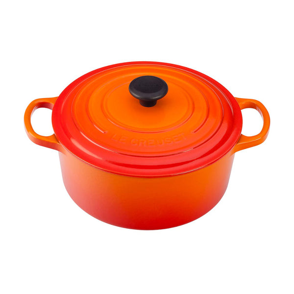 A flame / orange colored 3-1/2 Quart Le Creuset Signature Enameled Cast Iron Round French/Dutch Oven